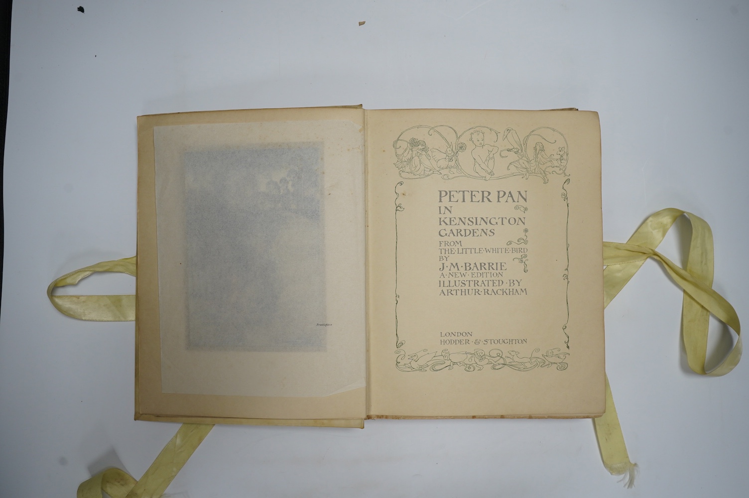 Barrie, J.M. - Peter Pan in Kensington Gardens, illustrated by Arthur Rackham, including 50 tipped-in colour plates, captioned tissue guards, pictorial endpapers, 4to, original vellum pictorially gilt, top edge gilt, rib